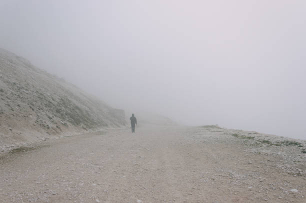 istock Man walking in the fog 961494918