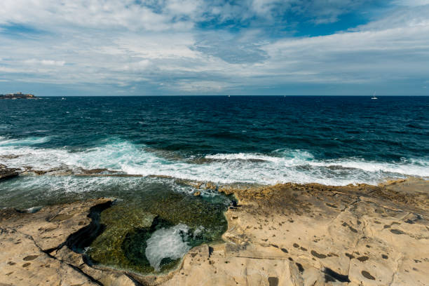 istock Rocky beach at Sliema, Malta 961500126