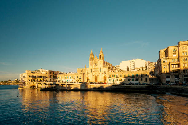 The Carmelite Church at sunset, Balluta Bay, St Julians, Malta The Carmelite Church at sunset, Balluta Bay, St Julians, Malta st julians bay stock pictures, royalty-free photos & images