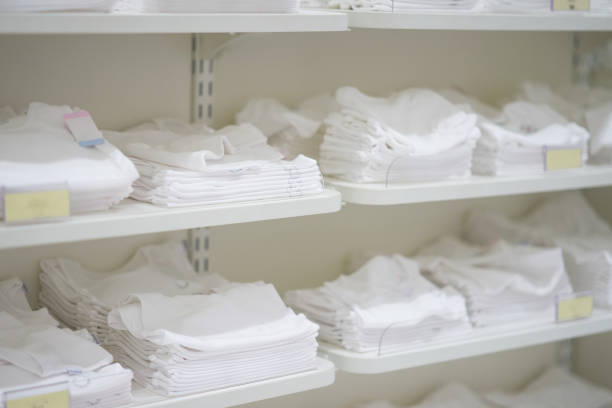 istock White clothes in shelves for sale 961504070