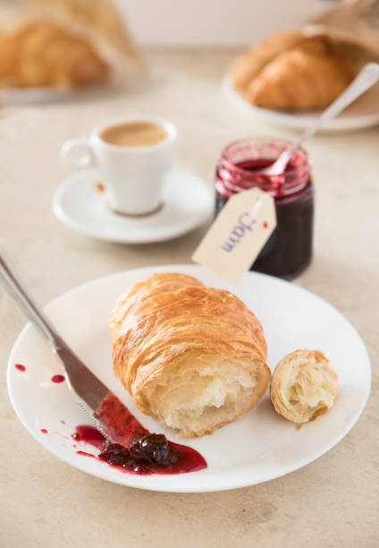 istock Fresh breakfast at morning. Croissant with jam and coffee. 961505224