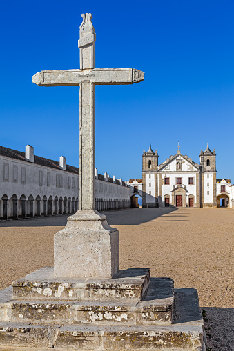 Stone Cross in front of the Church and Pilgrim lodgings of the Sanctuary of Nossa Senhora do Cabo. Espichel Cape, Sesimbra, Portugal