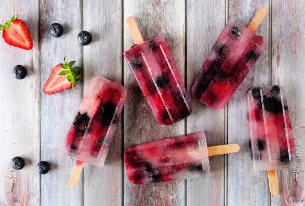 istock Healthy berry fruit popsicles, flat lay on rustic wood 961511326