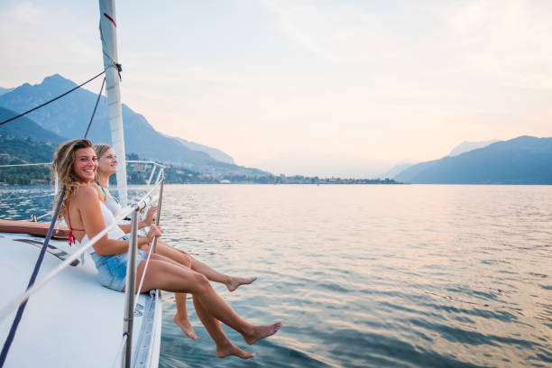 istock Girls enjoy sailing trip 961514894