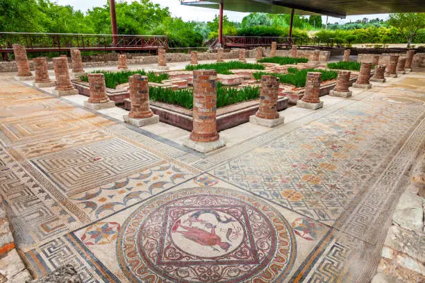 House of the Fountains in Conimbriga. View of the very ornate mosaics, peristyle, garden and pond. Conimbriga in Portugal, is one of the best preserved Roman cities on the west of the empire.