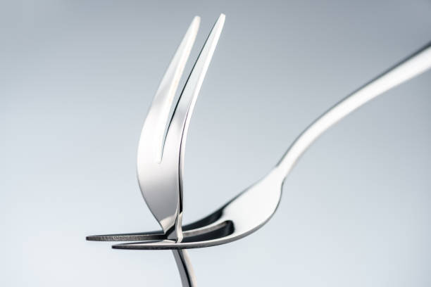 istock shiny forks with two tines isolated on grey 961520564