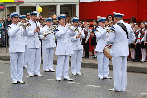 Pyatigorsk, Russia - May 9, 2018: Musicians of the Military Band in white uniform on parade to annual Victory Day in WWII