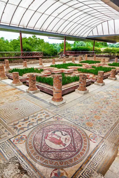 House of the Fountains in Conimbriga. View of the very ornate mosaics, peristyle, garden and pond. Conimbriga in Portugal, is one of the best preserved Roman cities on the west of the empire.
