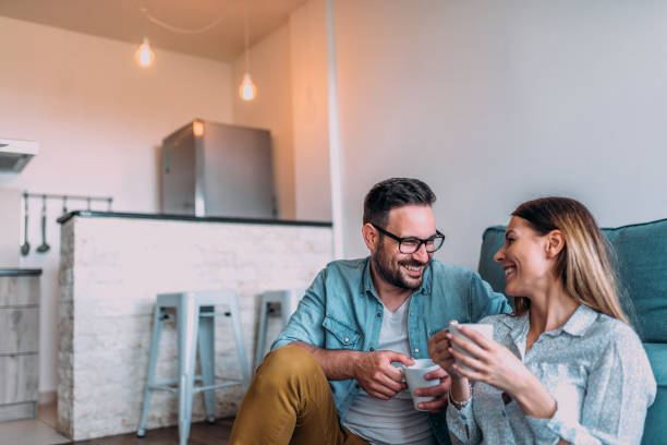 istock Smiling couple enjoying weekend at home. 961524028