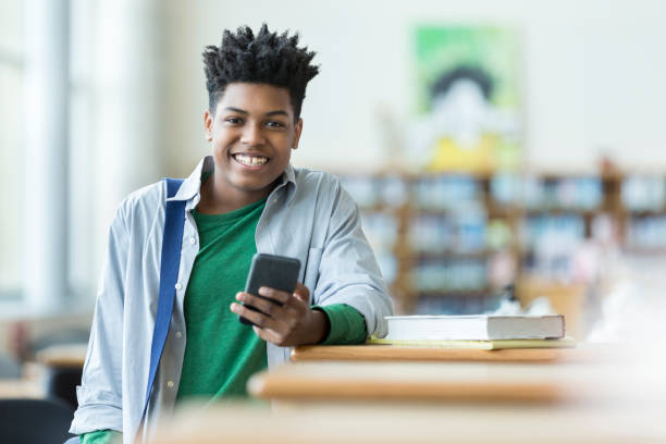 istock Cheerful high school student in the campus library 961524970