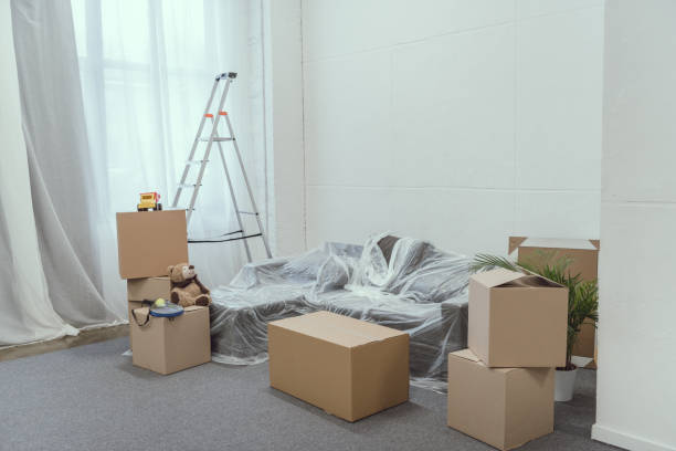 istock stacked cardboard boxes, ladder and toys in empty room during relocation 961525478