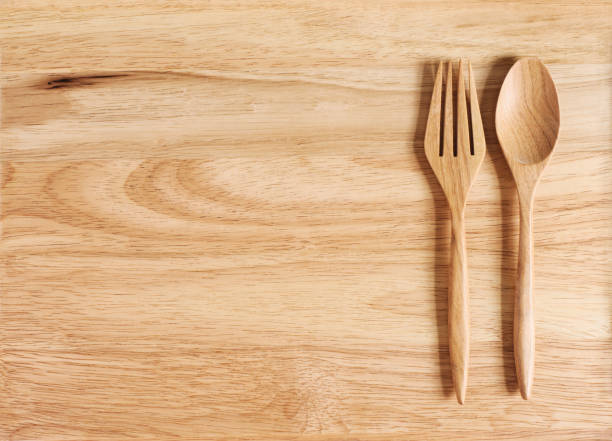 istock wood plate and  spoon with frok isolate 961525866