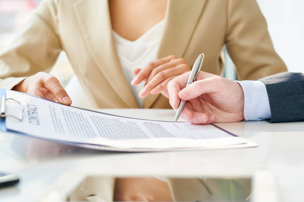 istock Unrecognizable Businessman Signing Contract Close Up 961525936