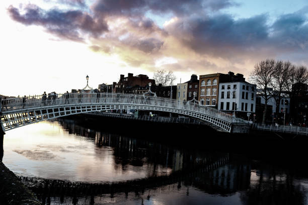 istock dramatic scene Dublin night scene with Ha'penny bridge and Liffey river lights 961529026