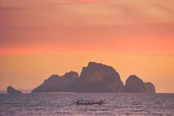 Longtail boat in thailand during a beautiful sunset.