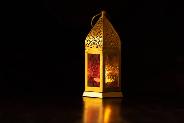 istock Traditional ornamental arabic candle in dark light. 961530536