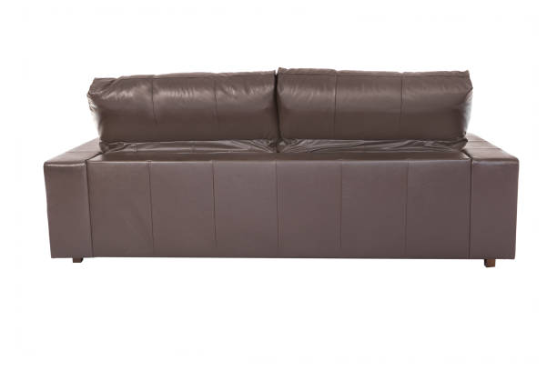 istock Large brown sofa cozy leather isolated on white background 961539476