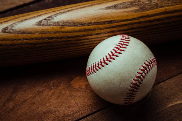 istock Vintage baseball gear on a wooden background 961543848