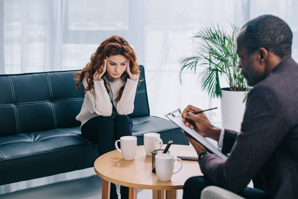 istock Upset young woman on couch 961551960
