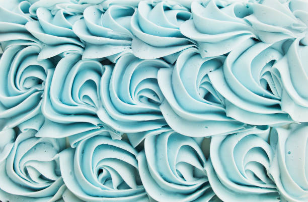 Cake Icing Floral Swirl Background Blue cake icing swirl decoration background pattern. icing stock pictures, royalty-free photos & images