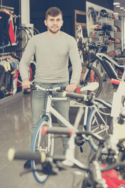 istock male standing with sport bicycle 961552706