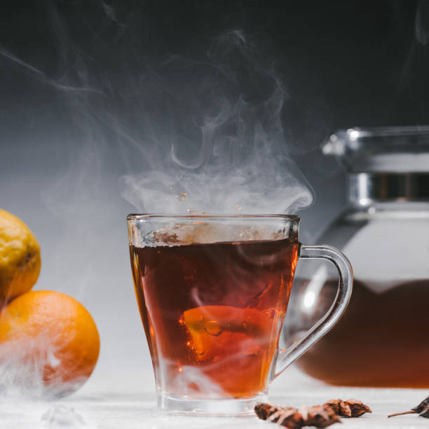 istock Steaming cup of spicy black tea with lemon 961553480