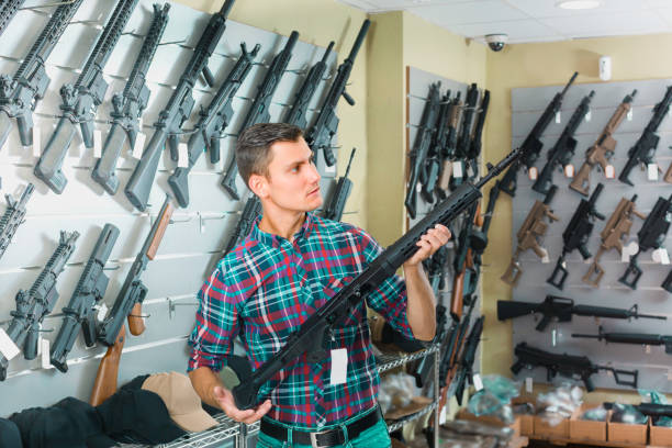 istock Young man is choosing air-powered gun 961556218