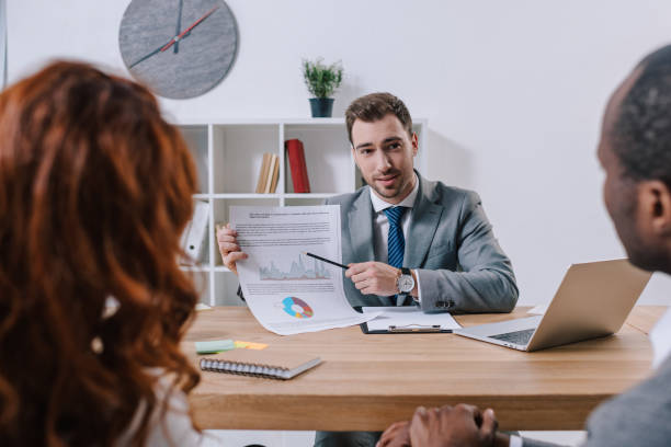 istock Investment adviser showing presentation to clients 961557160