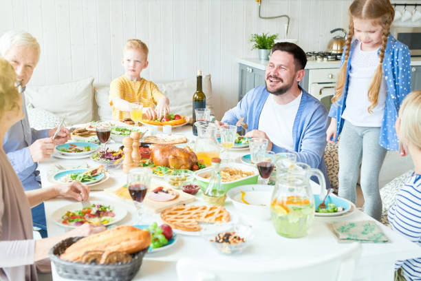 istock Family Enjoying Dinner Together 961560380