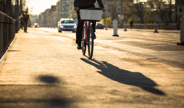 istock Bikers on a city street in warm evening sunlight 961564236