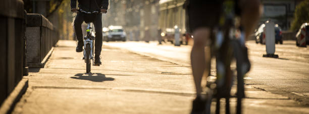 istock Bikers on a city street in warm evening sunlight 961564784