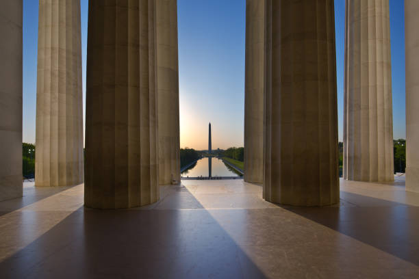Sunrise Washington Monument Viewed from Lincoln Memorial in Washington DC, USA Sunrise scene of the Washington Monument viewed from the Lincoln Memorial of Washington DC, USA. lincoln memorial photos stock pictures, royalty-free photos & images