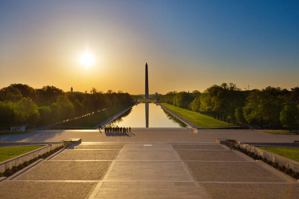 Sunrise Washington Monument Viewed from Lincoln Memorial in Washington DC, USA Sunrise scene of the Washington Monument viewed from the Lincoln Memorial of Washington DC, USA. washington monument reflecting pool stock pictures, royalty-free photos & images