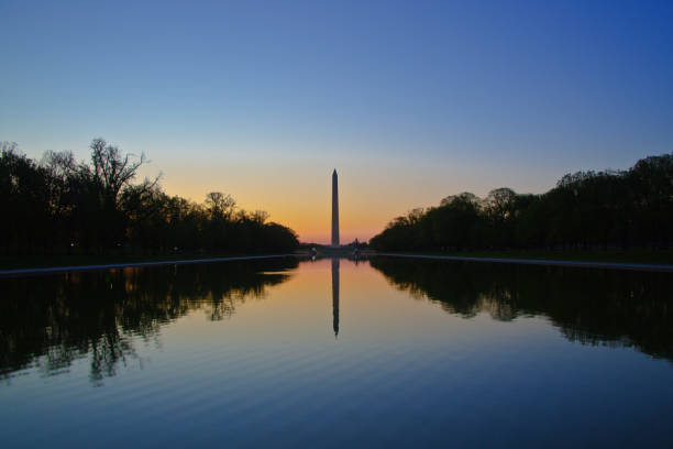 istock The Washington Monument Sunrise and Reflecting Pool in Washington DC 961565066
