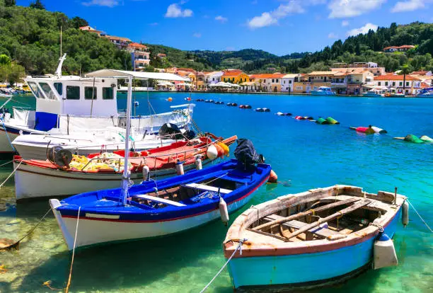 Photo of Beautiful authentic Greece - pictorial bay with fishing boats in Paxos. Ionian islands