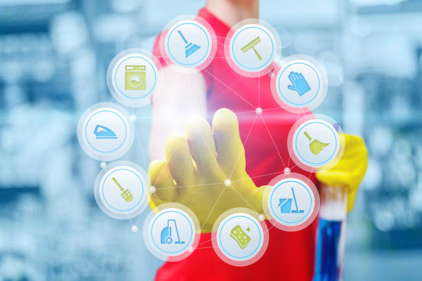 istock Cleaning lady clicks on the screen. 961573062