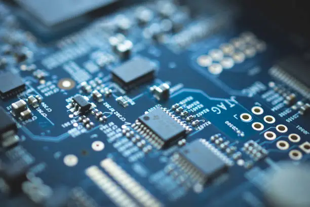 Photo of closeup of electronic device circuit board with processor background blue texture technology computer serve cpu motherboard chip component