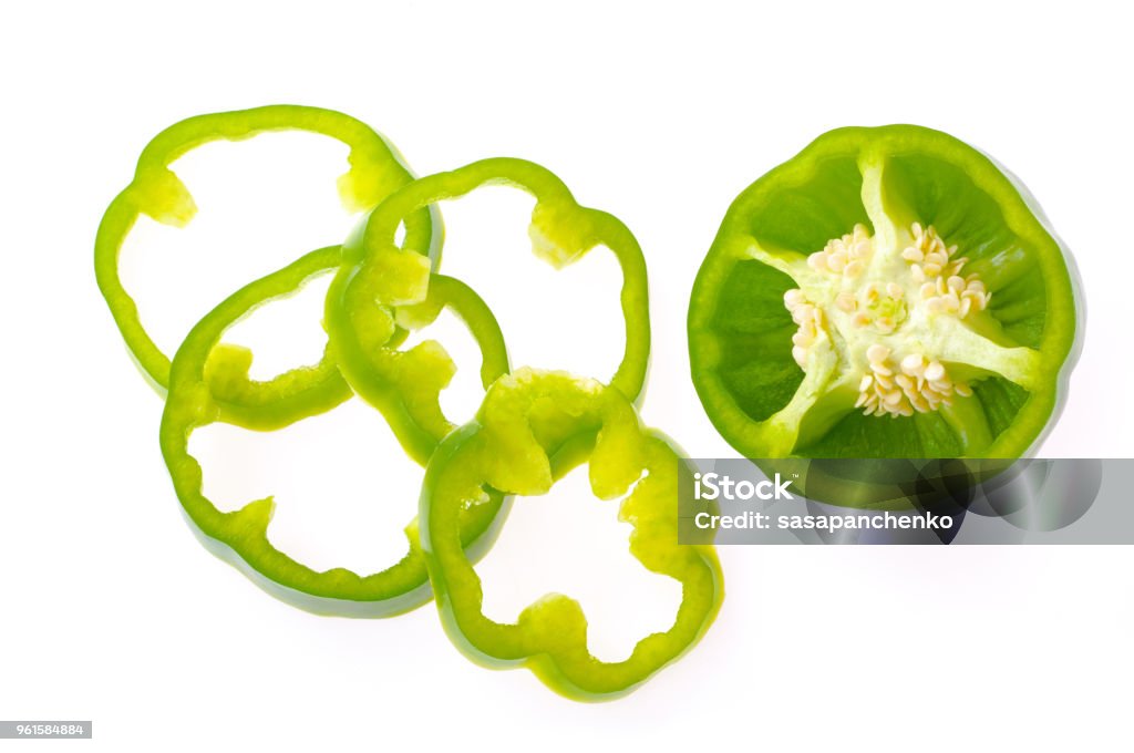 Fresh bell pepper with sliced parts isolated on white background Green Bell Pepper Stock Photo