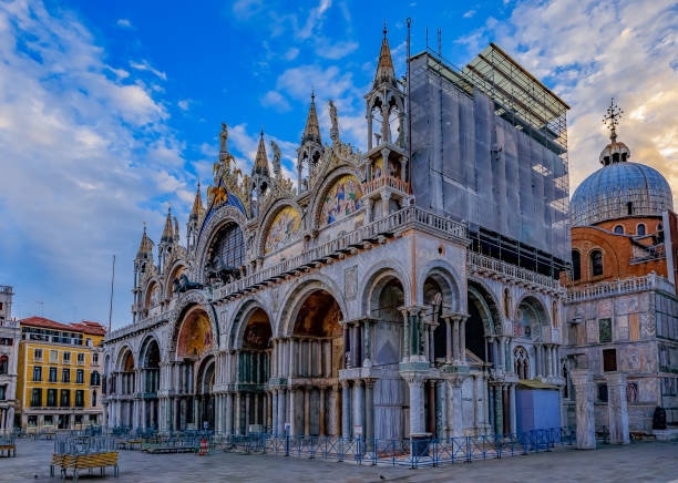 istock Saint Mark's square with and Saint Mark's Basilica at sunrise in Venice Italy 961590050