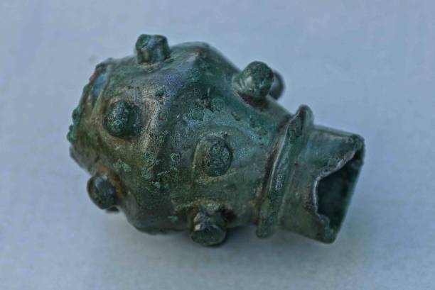 istock old antique bronze mace green on a gray table 961590388
