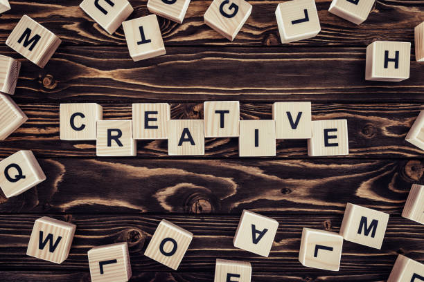 istock flat lay with blocks arranged in creative word on brown wooden surface 961591938