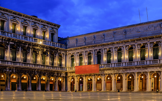 The picturesque National Library of St Mark's and Museo Correr on Piazza St Marco or Saint Mark's square at sunrise in Venice Italy