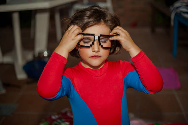 istock Portrait child dressed with costume and glasses accesory. 961605770