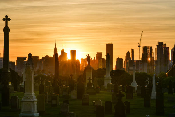 istock Manhattan skyline with full on sunset and cemetery foreground 961613456