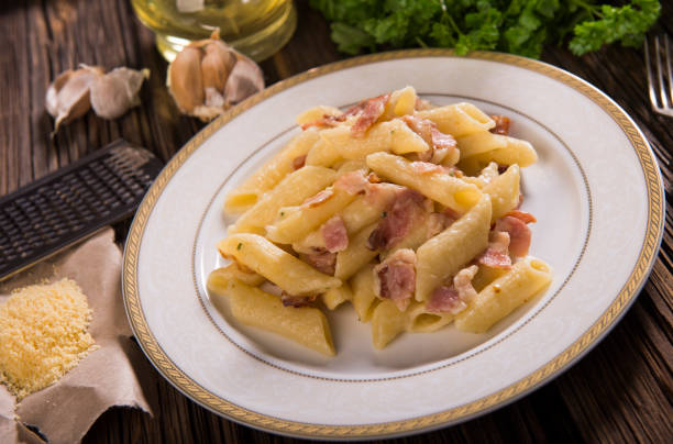 istock Pasta with cheese sauce and bacon 961619564