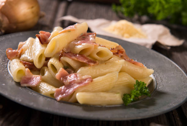 istock Pasta with cheese sauce and bacon 961619604