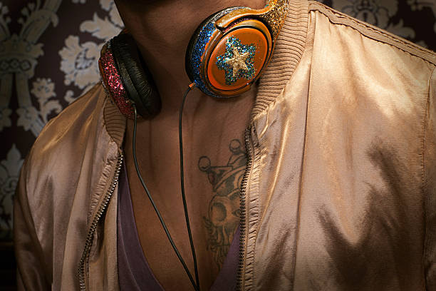 Close up of man with headphones around neck  chest tattoos for men designs stock pictures, royalty-free photos & images