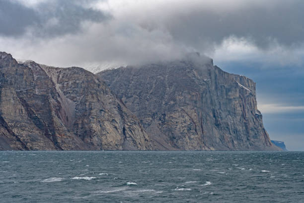 istock Looming Cliffs on a Coastal Fjord 961622786