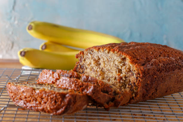 Banana Bread fresh sliced loaf of homemade banana bread BANANA BREAD stock pictures, royalty-free photos & images