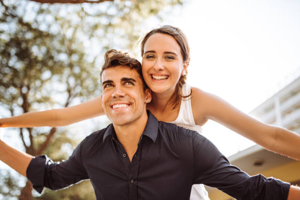 istock couple carrying on the street 961623408
